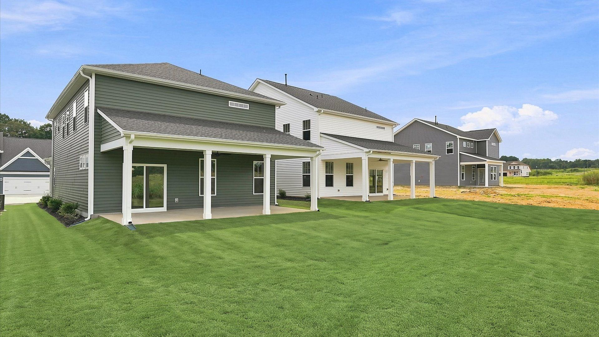 Refined rear exterior with a stylish covered porch for dining, relaxing, or entertaining