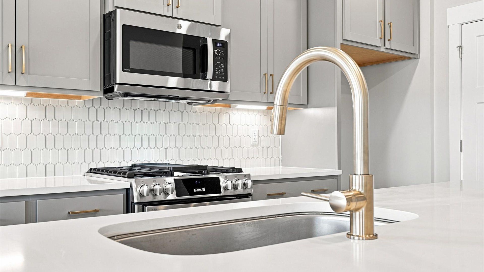 Vibrant kitchen layout with a center island, refined finishes, and open-concept flow
