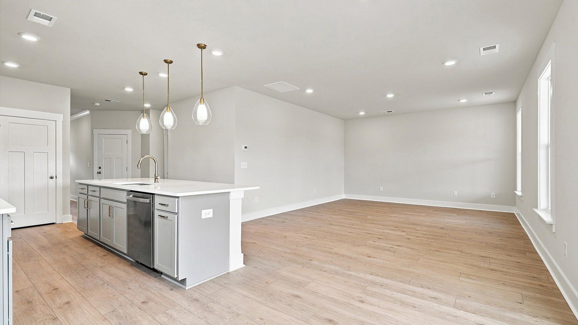 Exceptional culinary space with a striking 10-foot island and eye-catching pendant lights
