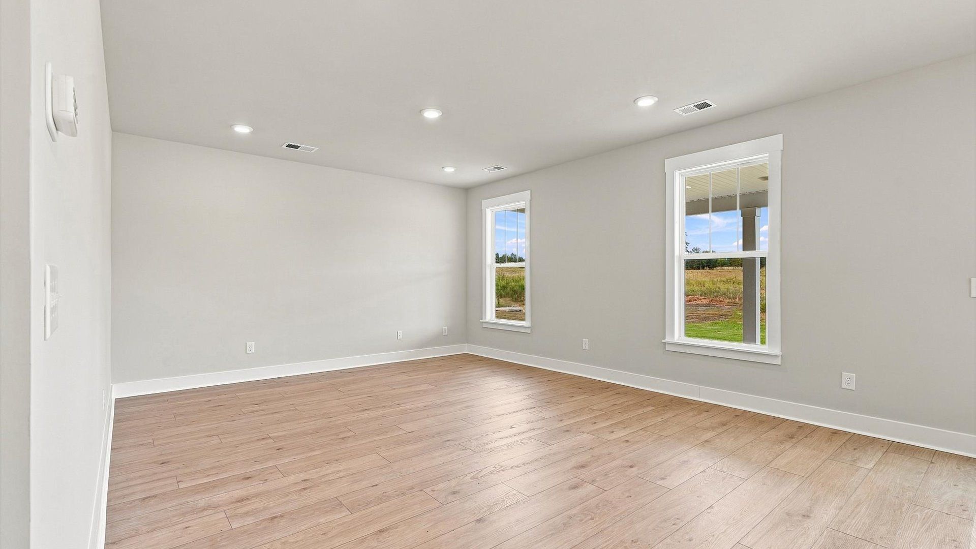 Accomplished layout centers around a spacious family room with exceptional flow and flexibility