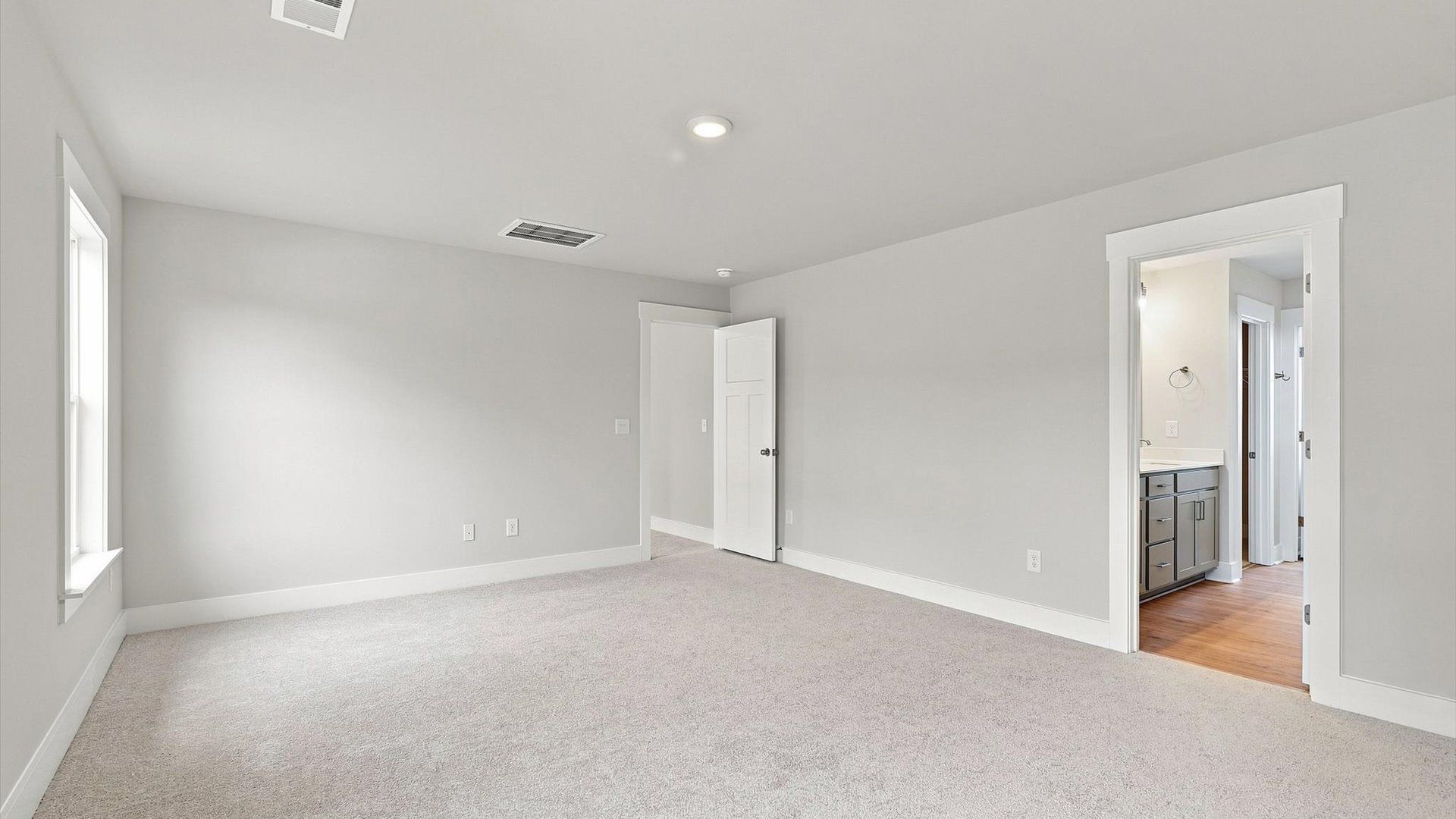 Spacious and serene primary suite with thoughtful design in a desirable DRB Homes community