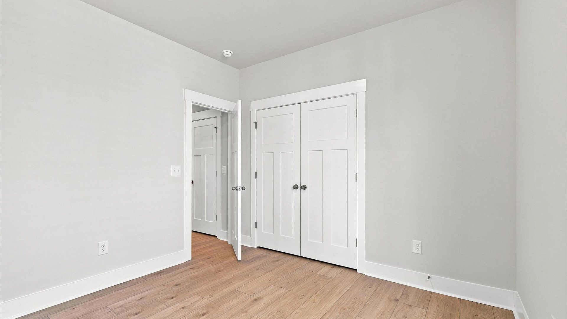 Desirable hardwood flooring in all bedrooms creates a cohesive and elegant interior