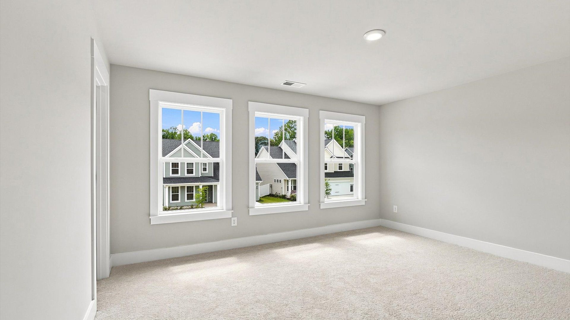 First-class secondary bedroom with comfortable carpeted flooring and generous closet space
