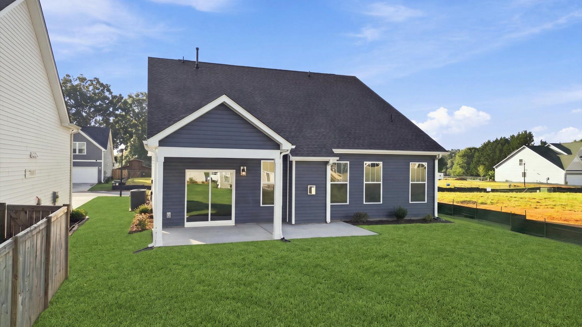 Highly functional rear covered porch adds memorable living space to this elegant home located in Inman, SC