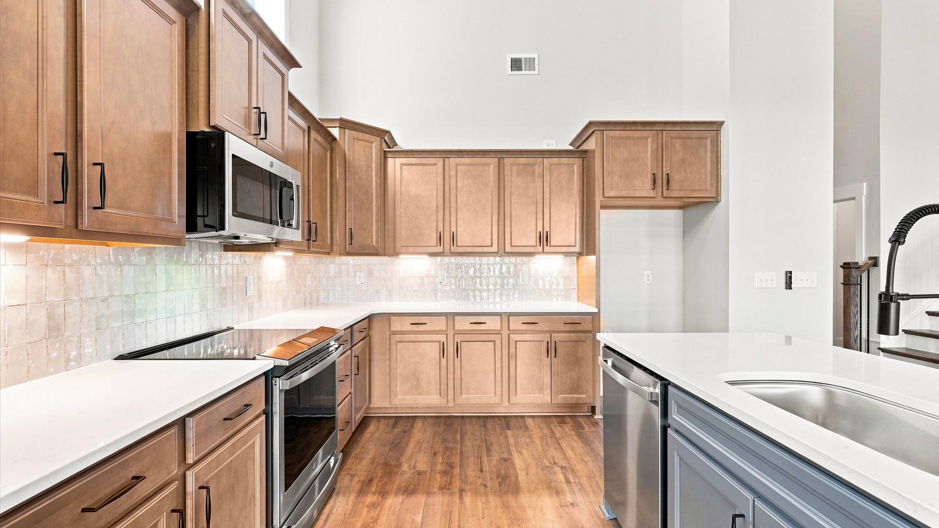 Expansive kitchen offering exceptional workspace and effortless flow to adjacent living areas by DRB Homes