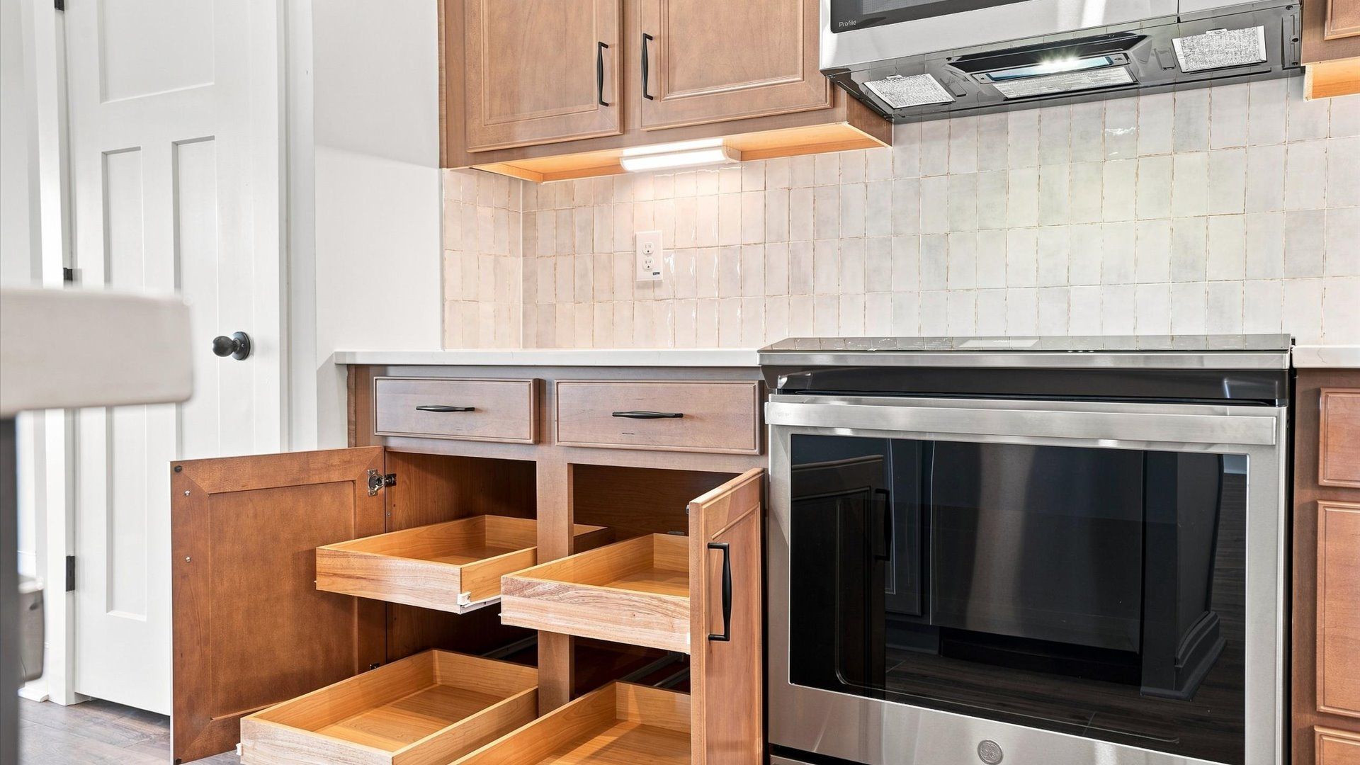 Highly skilled craftsmanship shines in this modern kitchen with abundant storage and stainless steel appliances