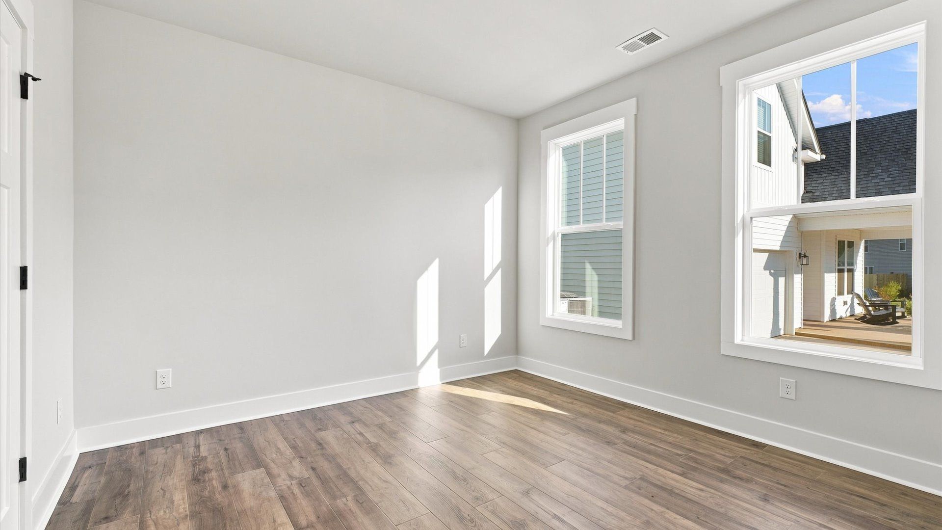 Thoughtfully designed rooms with hardwood flooring and generous proportions by DRB Homes