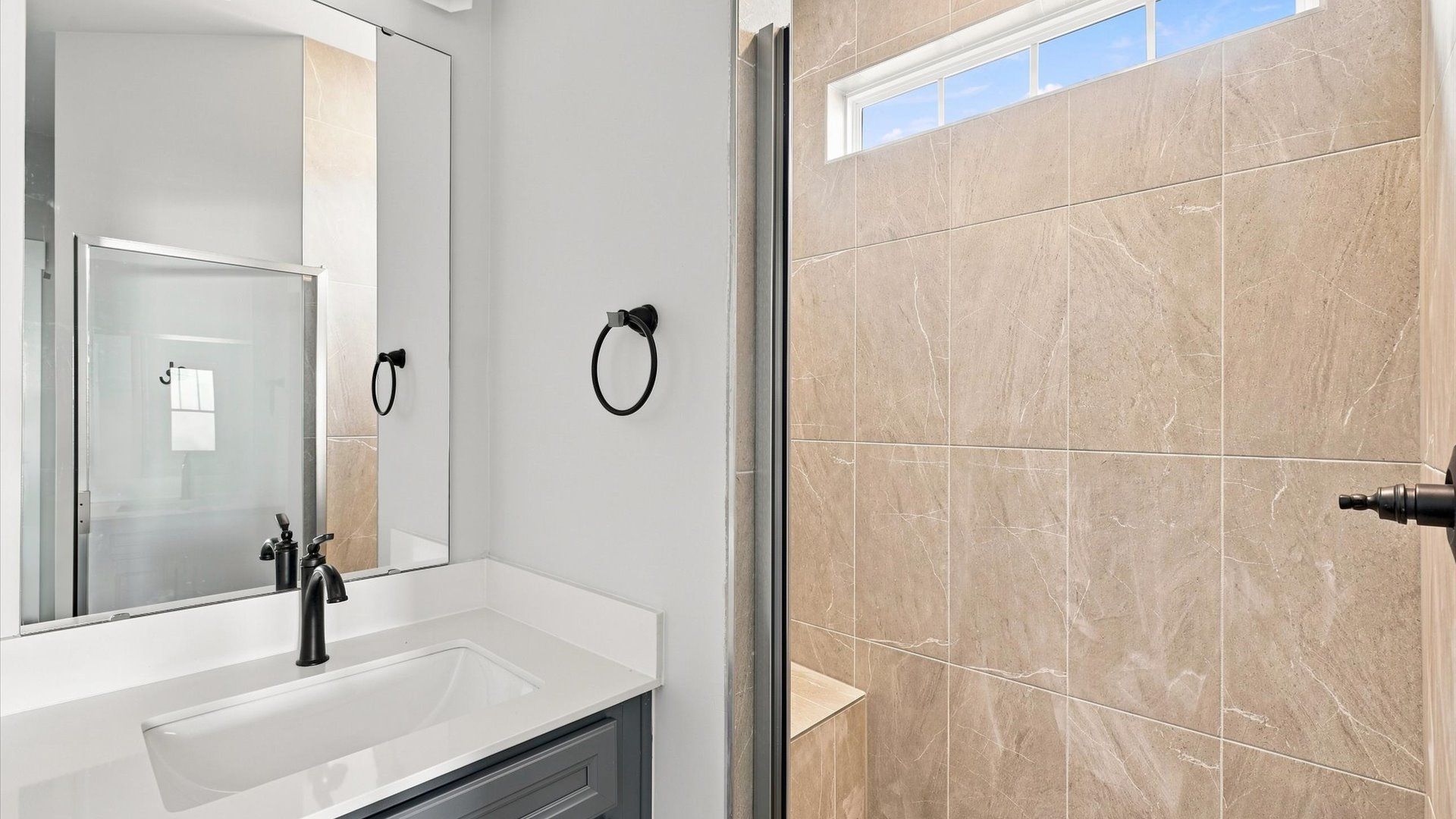 Top-notch bathroom with current fixtures, tasteful materials, and elevated charm by DRB Homes