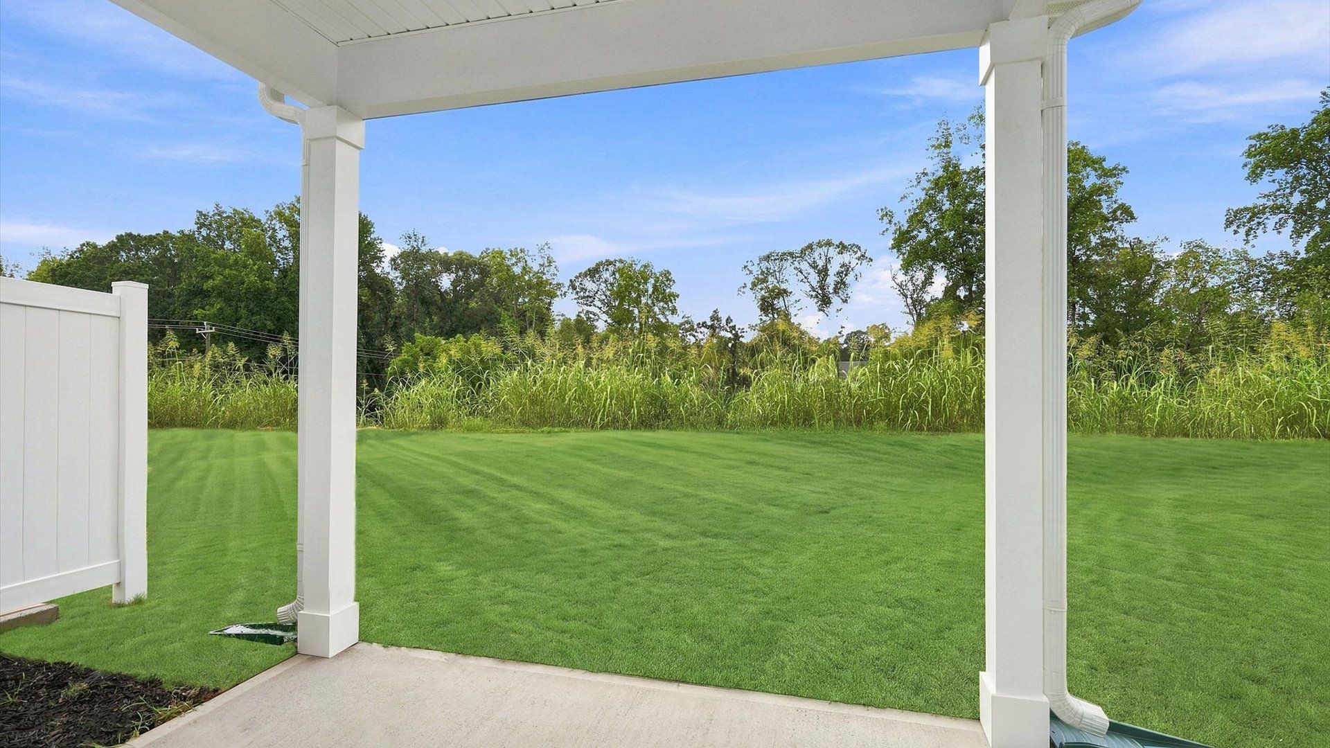 Exclusive rear covered porch with accomplished detail and elevated outdoor living potential by DRB Homes