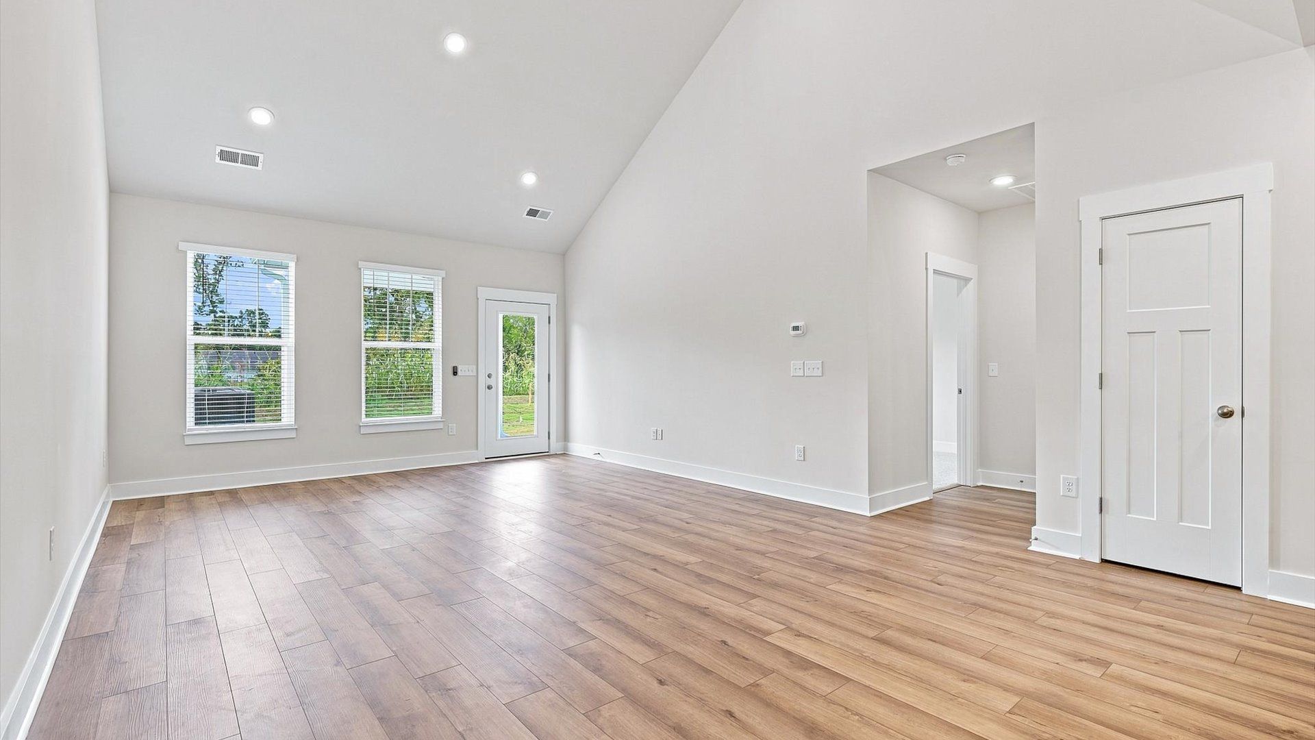 Tasteful family room with high ceilings, modern fixtures, and a warm, inviting feel in Anderson, SC