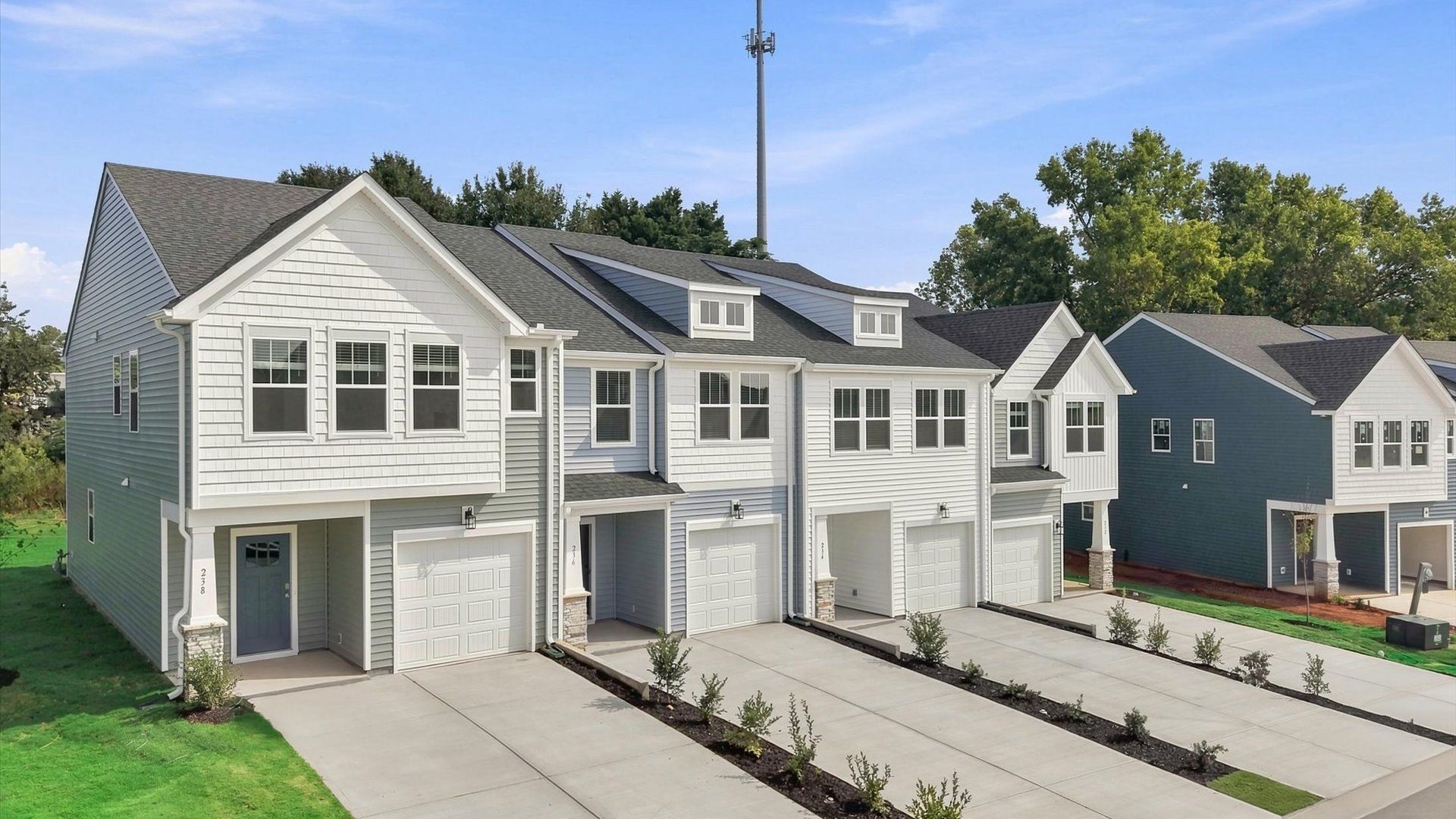 Vibrant home exterior in a thoughtfully planned community near city conveniences by DRB Homes