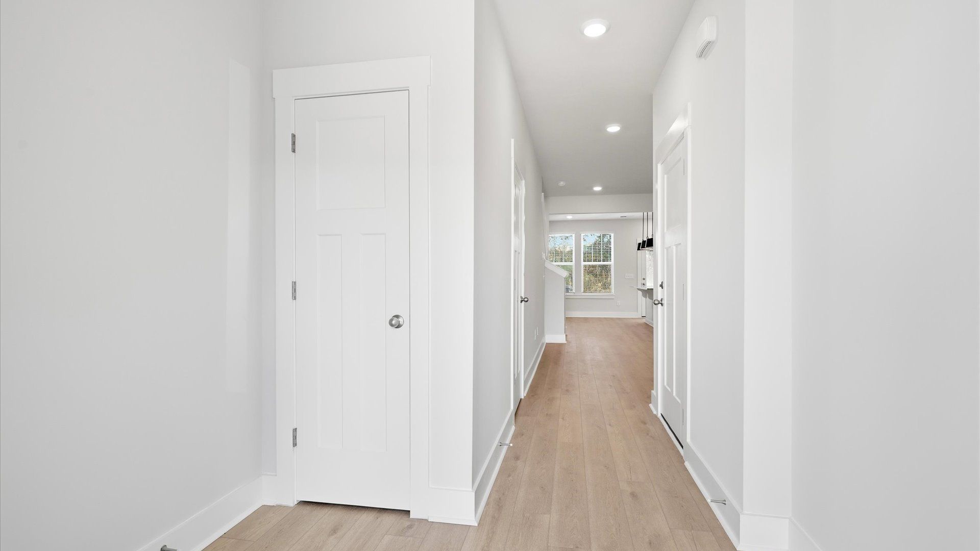 Stylish foyer with hardwood flooring and tasteful architectural detail in a superior layout near Lake Hartwell