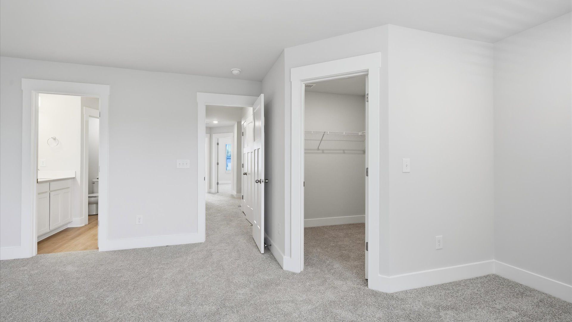 Exclusive upstairs retreat with a bright and airy primary suite with a walk-in closet by DRB Homes