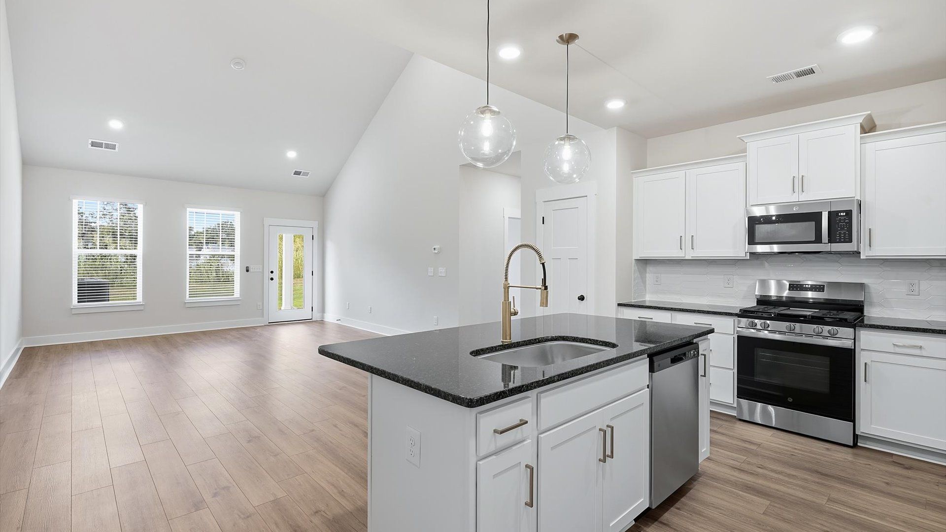 Expansive kitchen offering exceptional workspace and effortless flow to adjacent living areas by DRB Homes