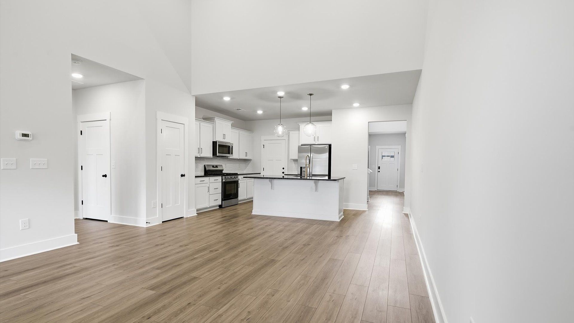 Elegant family room with hardwood flooring and open-concept flow in this first-class DRB Homes design