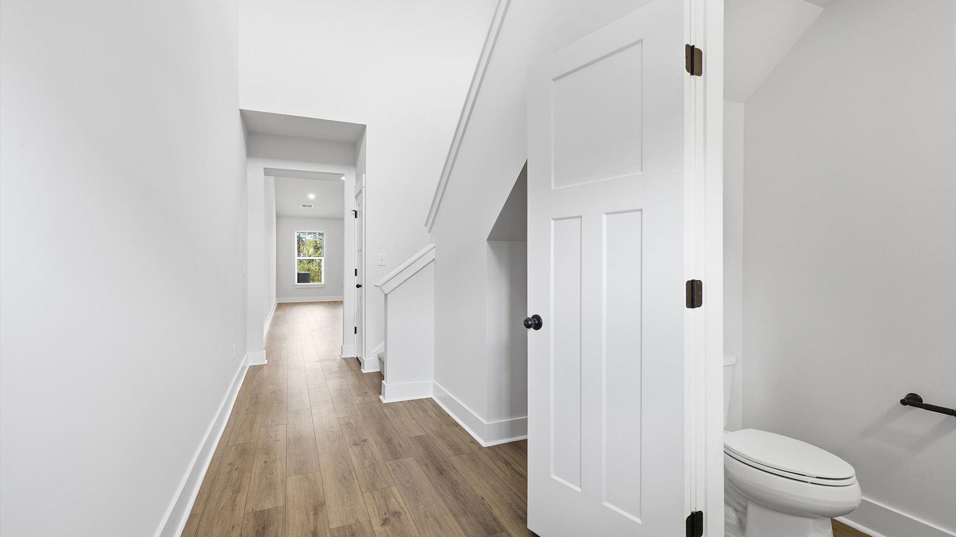Stylish foyer with hardwood flooring and tasteful architectural detail in a superior layout near Lake Hartwell