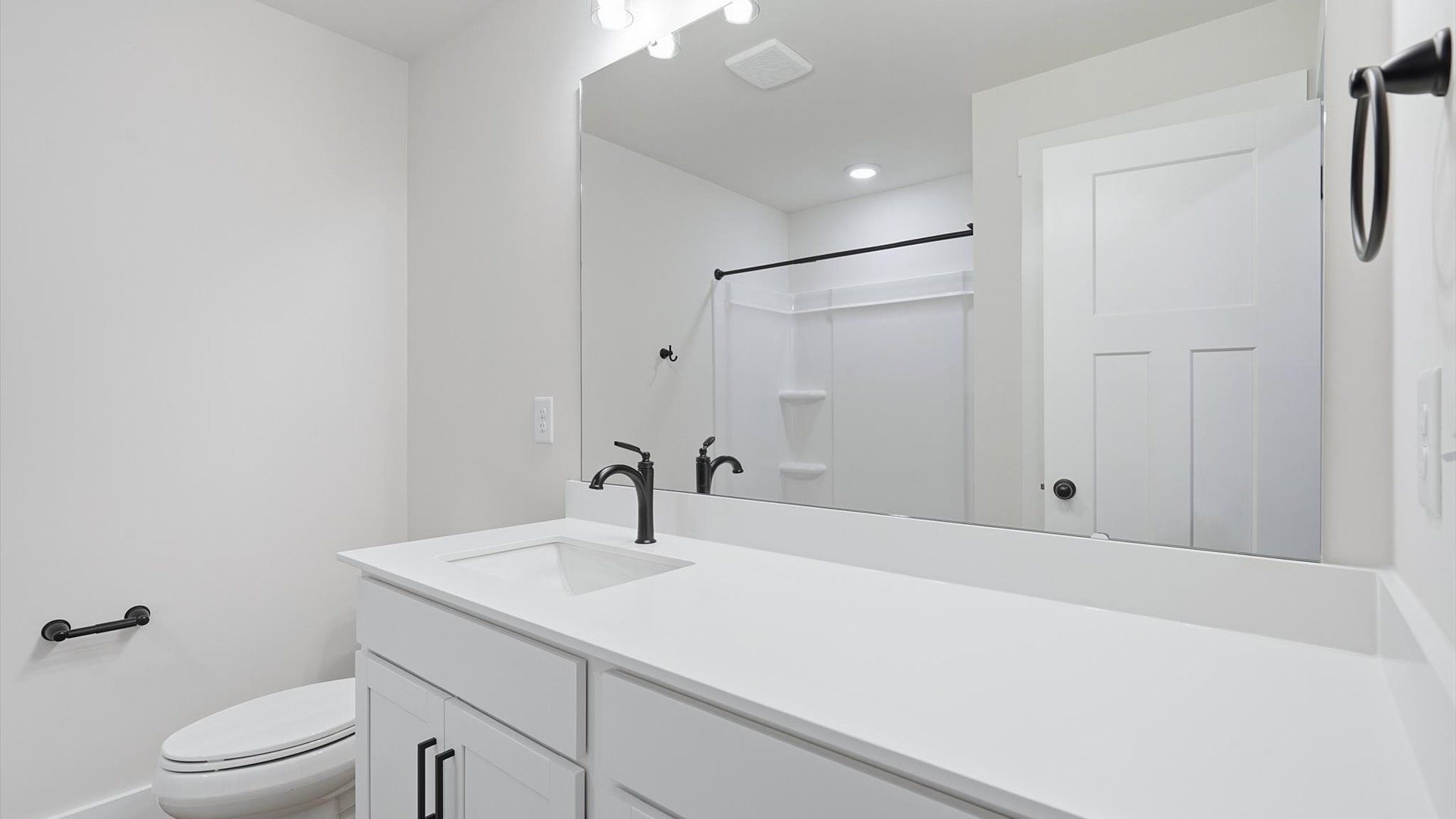 Accomplished bathroom design with sleek tile, high-quality cabinetry, and refined hardware near Lake Hartwell