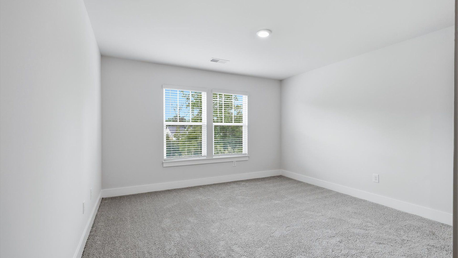 Vibrant and restful bedroom with oversized windows, refined detail, and a warm, welcoming atmosphere in Anderson, SC