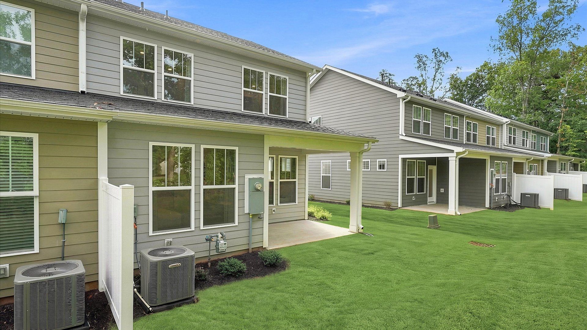 Rear covered porch of the Lawson floorplan creates a seamless extension of this home’s elegant design in Greenville, SC