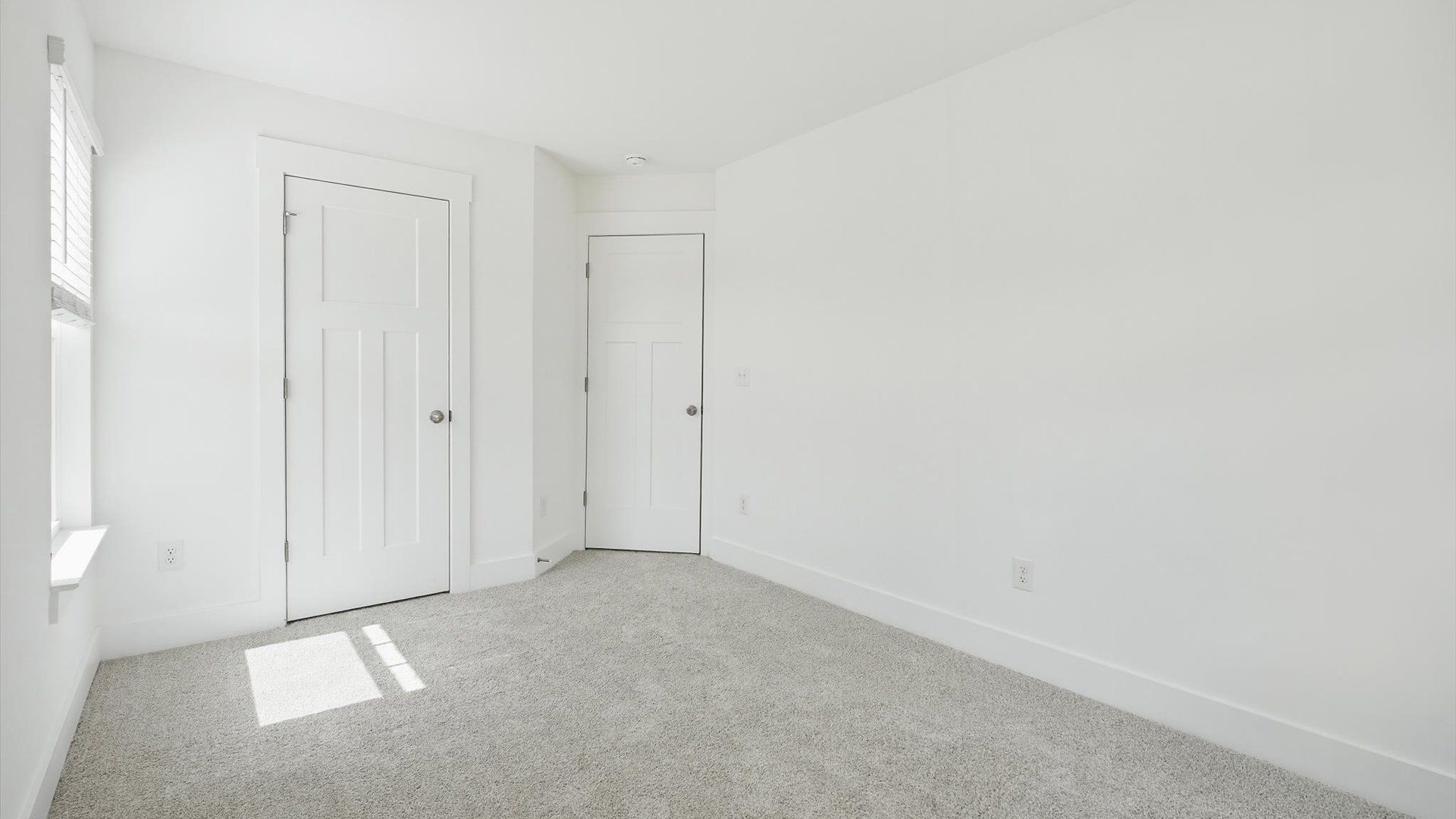 Superior comfort in a secondary bedroom with plush carpet and an oversized walk-in closet by DRB Homes