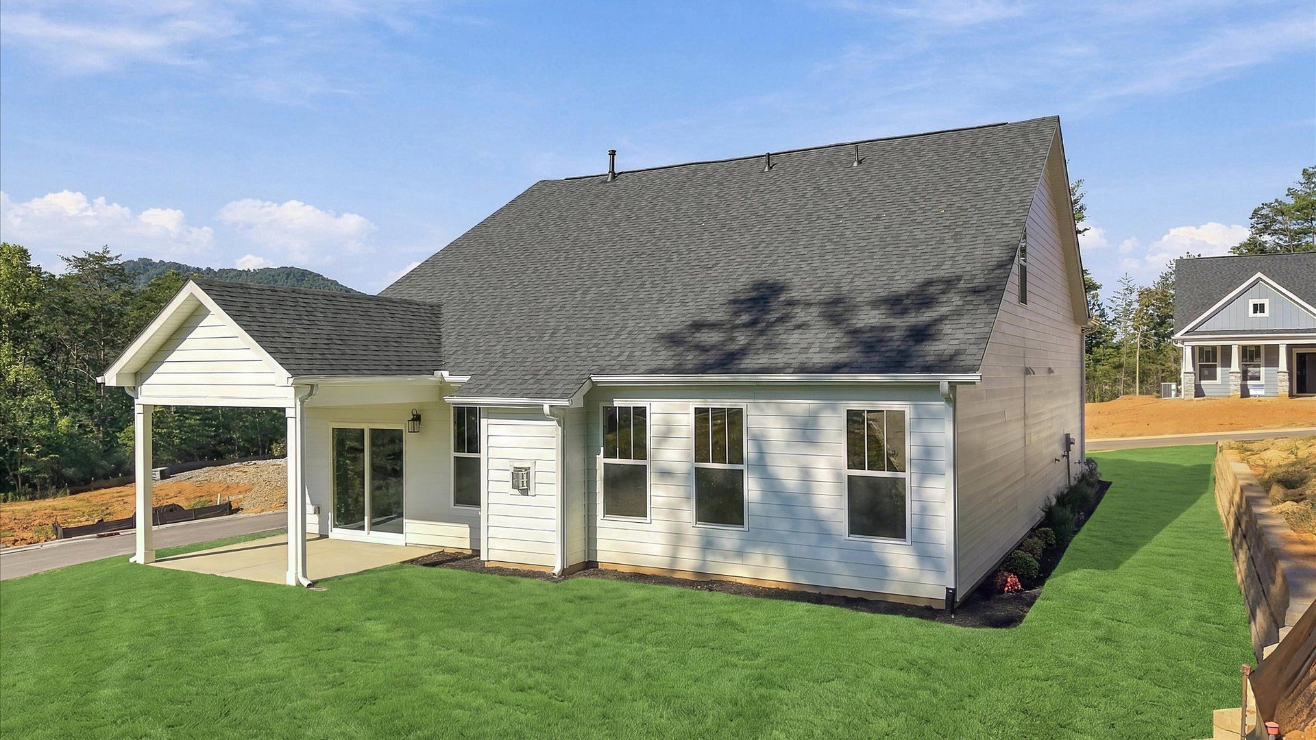 Accomplished exterior with a spacious rear porch that blends comfort and style