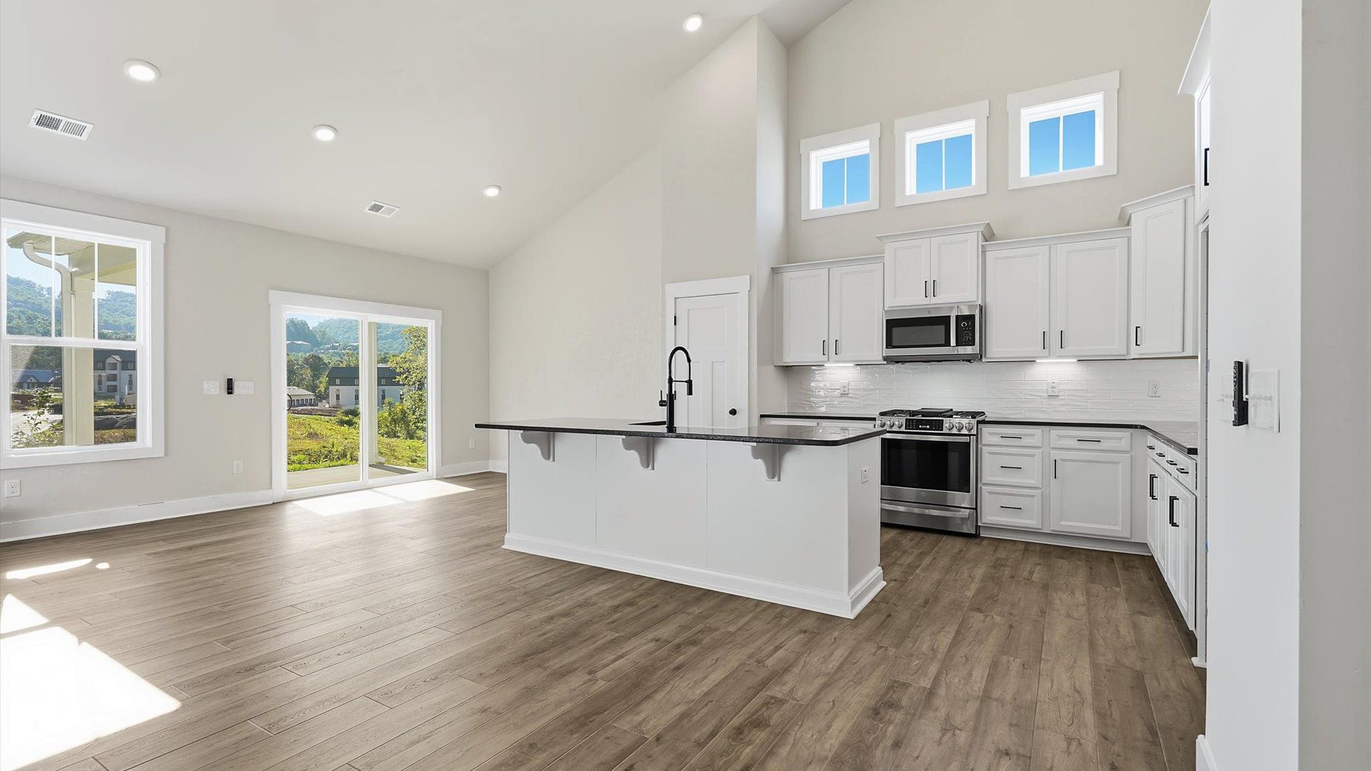 Tasteful kitchen with a streamlined island and modern finishes in a first-class DRB Homes design