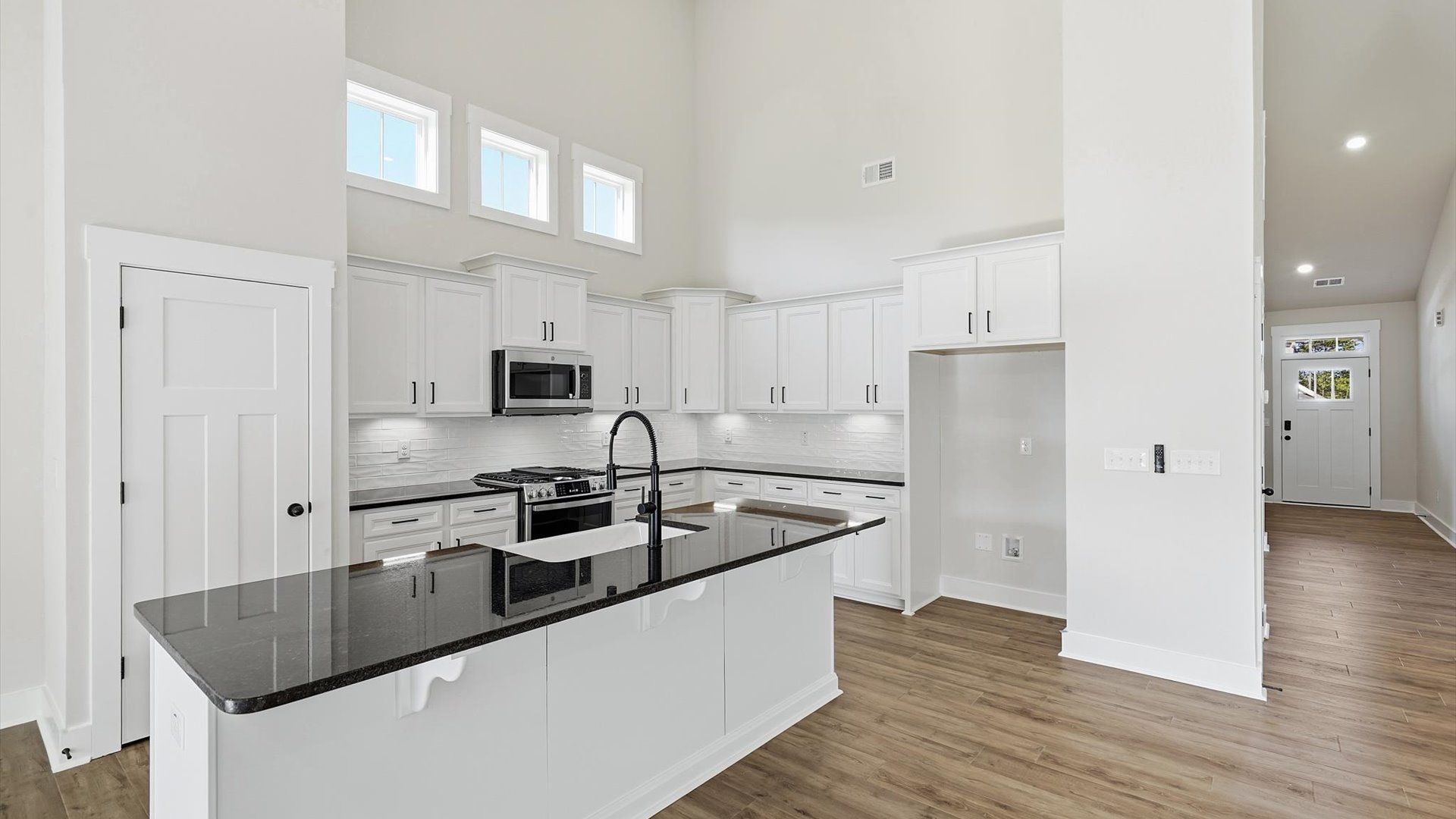 First-class finishes and a thoughtfully scaled island highlight this elegant kitchen space