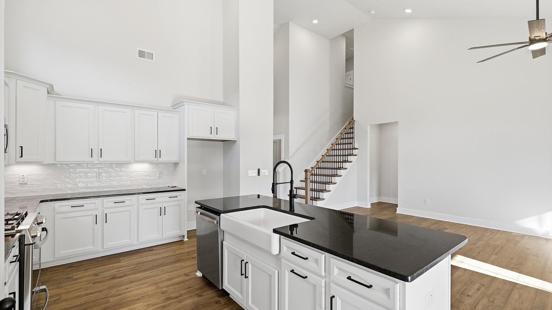 Elegant, oversized island anchors this tasteful kitchen with high standards and timeless appeal