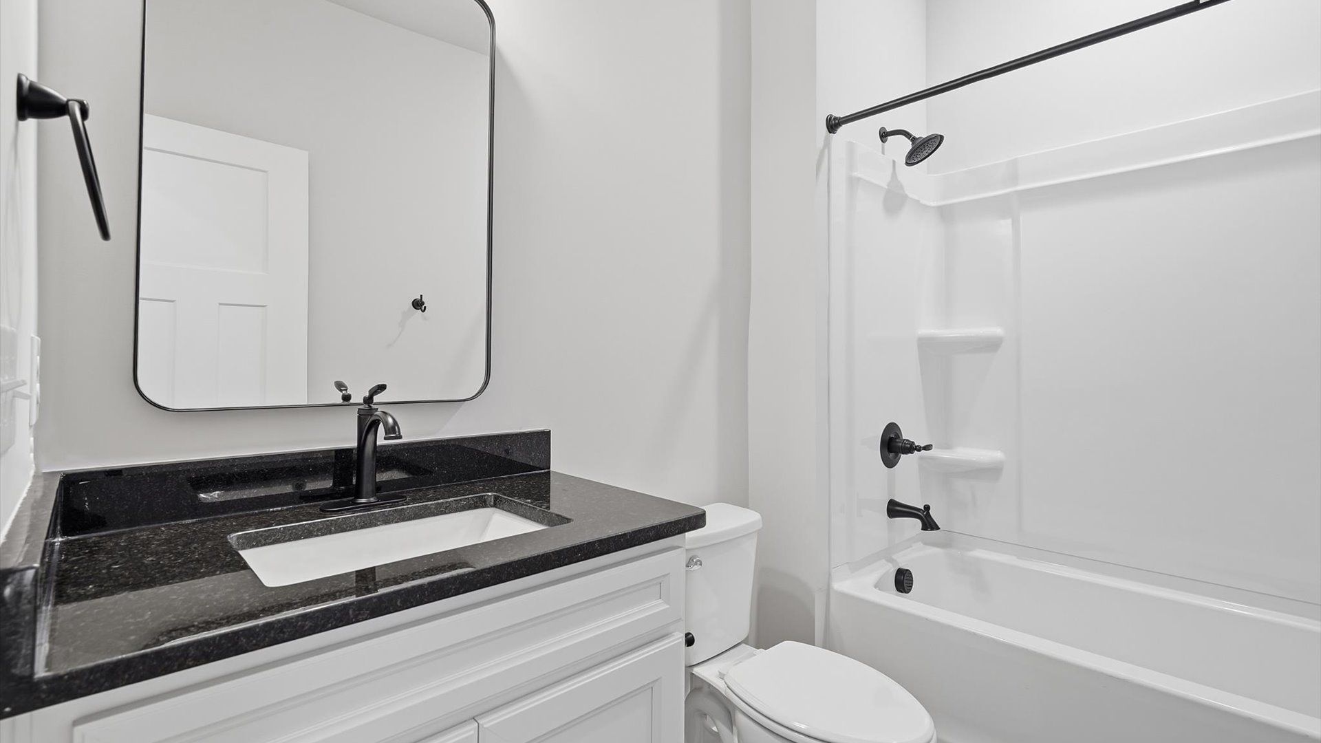 Vibrant and welcoming bathroom with elegant countertop space and polished details