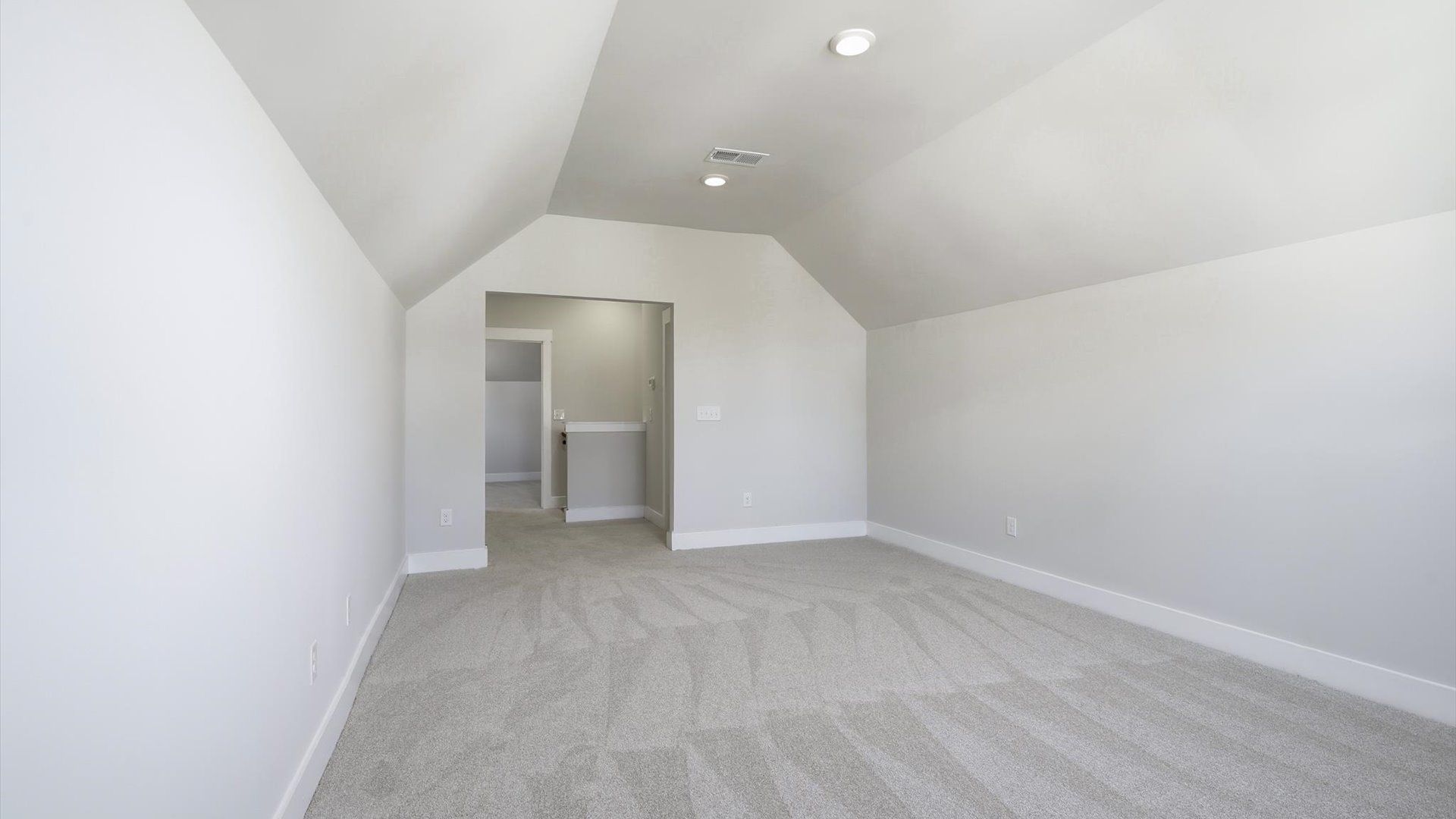 Notable carpeted bonus room designed with high standards and refined finishes
