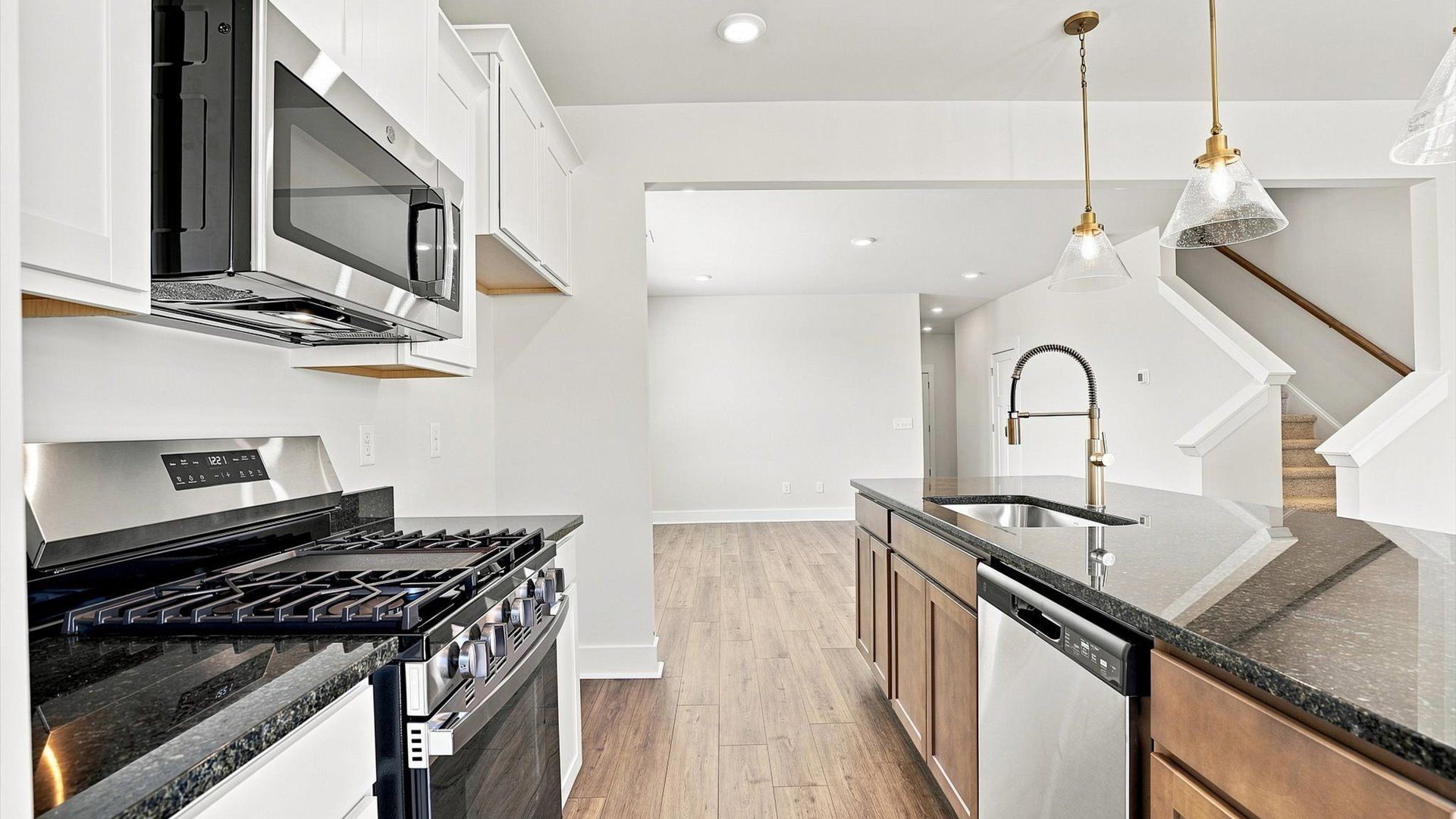 Exceptional culinary space with a striking 9-foot island and eye-catching pendant lights