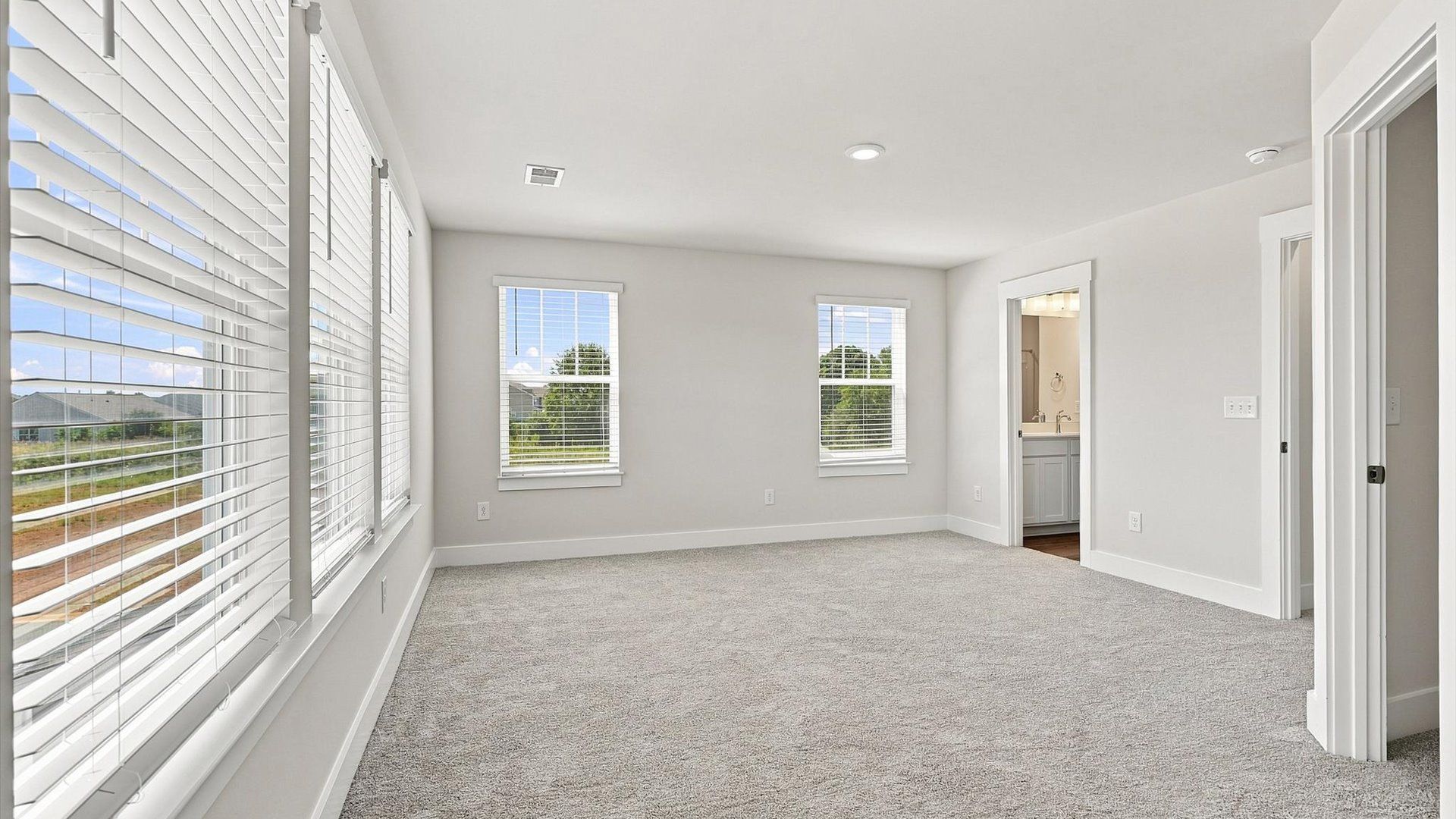 Primary suite that offers first-rate relaxation with established style and elevated finishes by DRB Homes