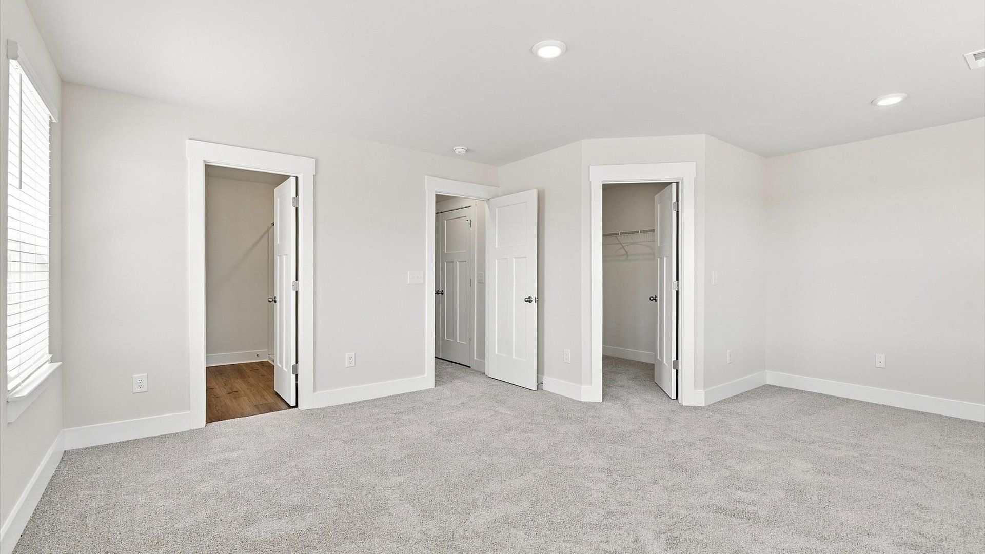 Eye-catching details and elegant finishes in the vibrant primary suite of this select home