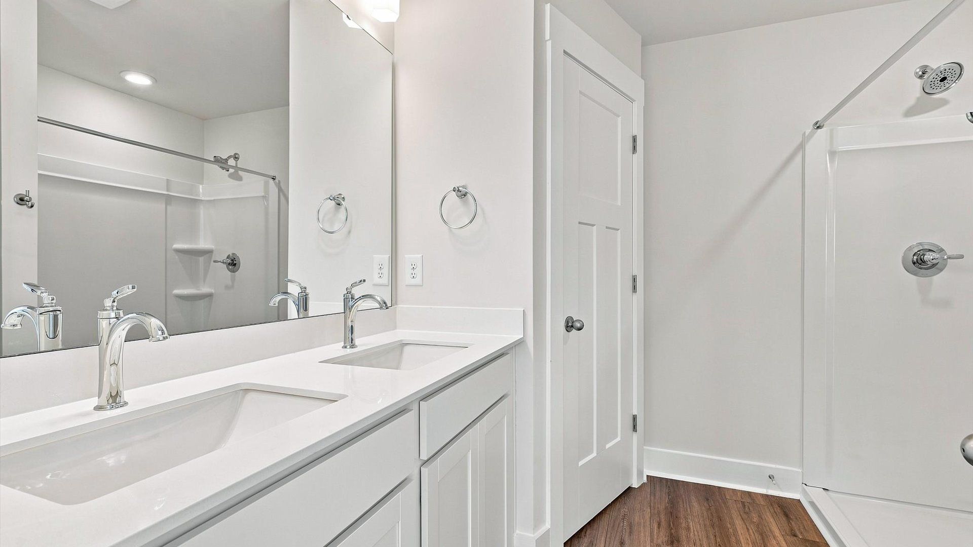 Notable primary suite with dual vanities and walk-in shower in this prime Piedmont villa