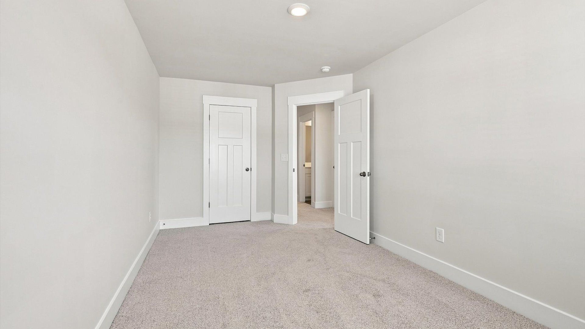 Vibrant and inviting secondary bedroom featuring a walk-in closet and refined finishes by DRB Homes