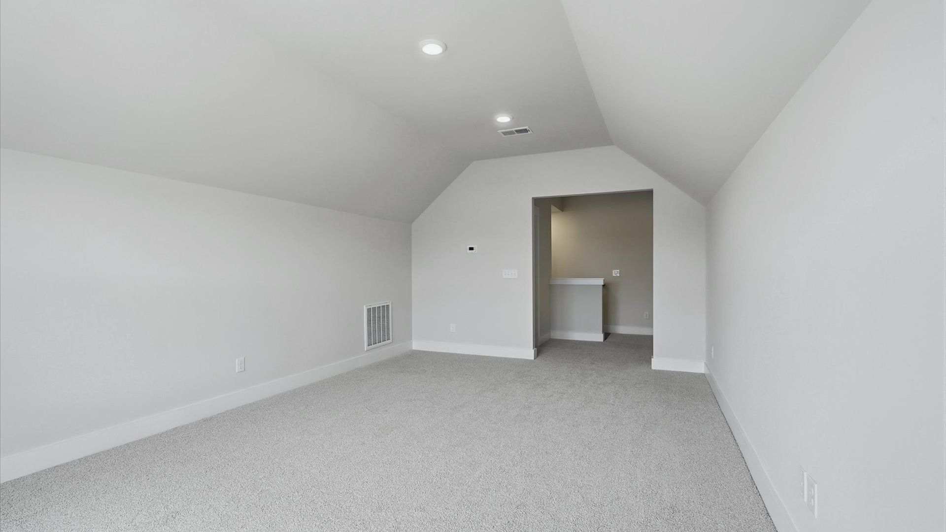 Memorable upstairs bonus room with plush carpeting and a bright, welcoming atmosphere at the Fox Hollow community