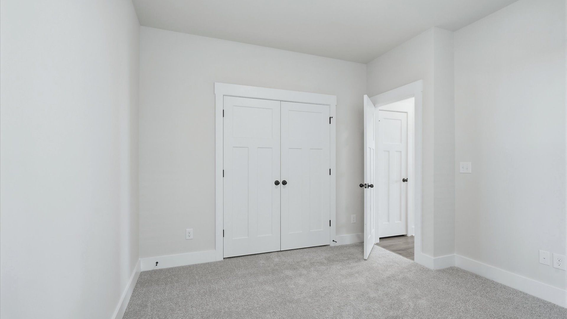 First-rate secondary bedroom with a spacious walk-in closet and elegant carpeted flooring in Spartanburg, SC