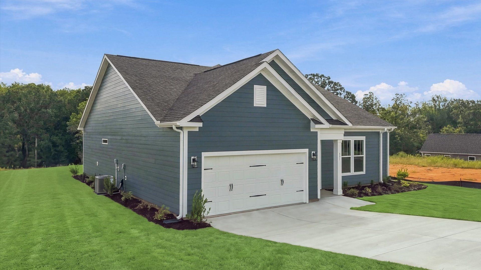 Exclusive DRB Homes exterior with balanced proportions and vibrant curb appeal in Woodruff, SC