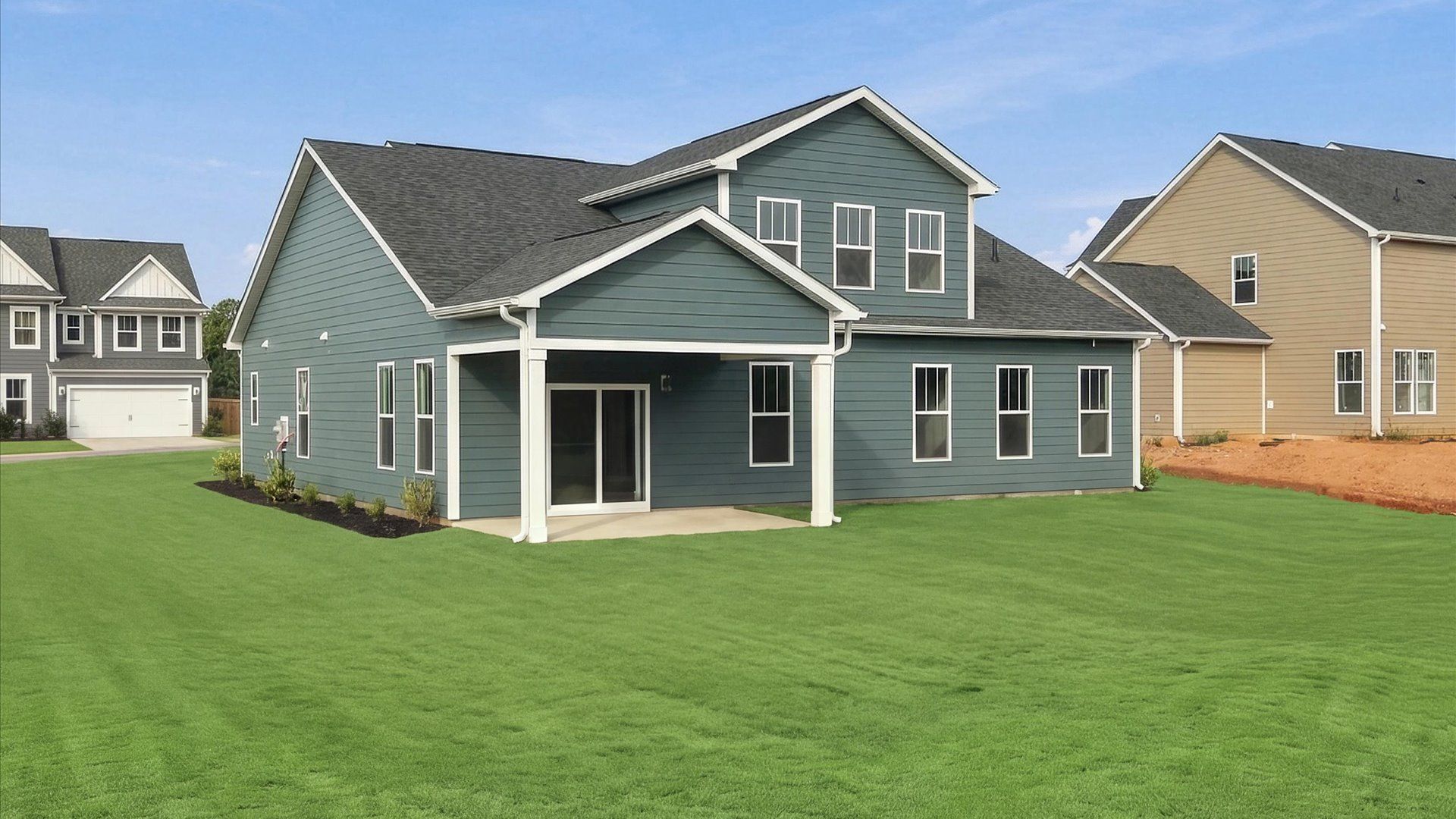 Vibrant rear outdoor space featuring a covered porch and exceptional craftsmanship at Pinebrook