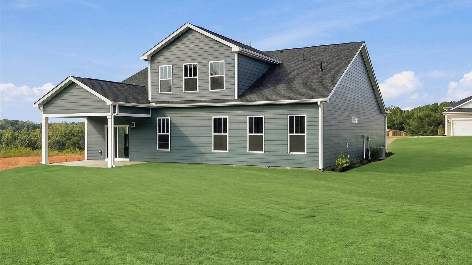 Warm and inviting outdoor living space with a covered rear porch and tasteful finishes