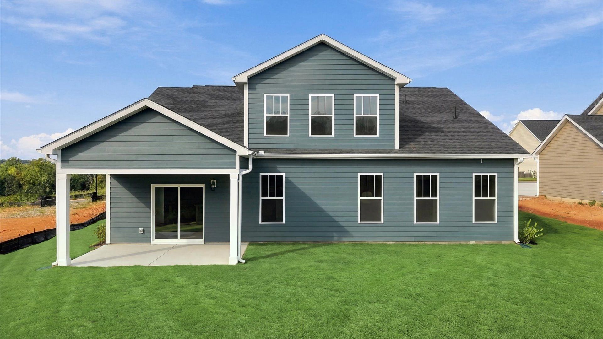 Superior curb appeal continues to the back with a refined, covered outdoor living space at Pinebrook