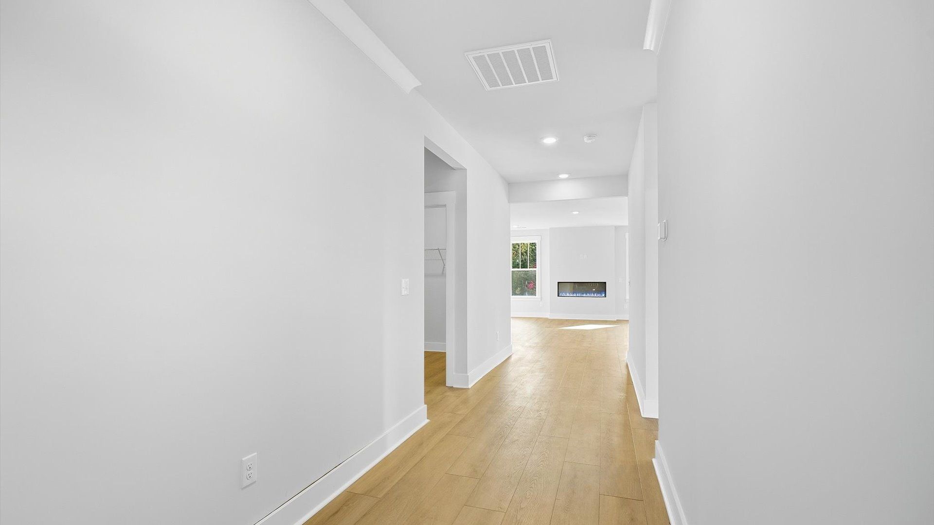 Stylish foyer with hardwood flooring and tasteful architectural detail in a superior layout by DRB Homes