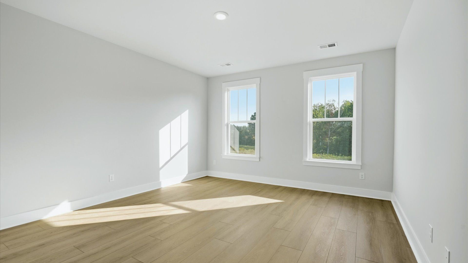 Vibrant natural light fills this exceptional primary suite with eye-catching details located in Woodruff, SC
