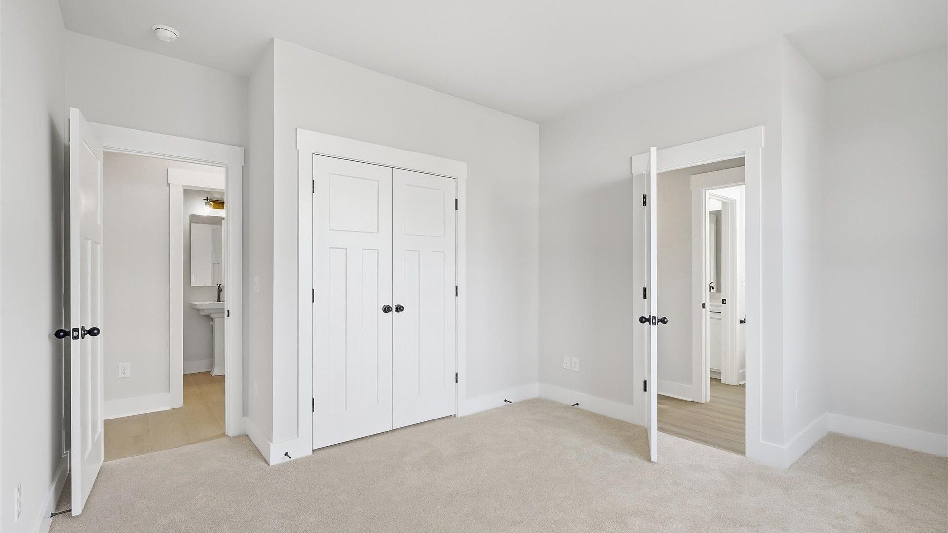 Notable secondary bedroom offering cozy carpeted flooring and a stylish walk-in closet at Pinebrook