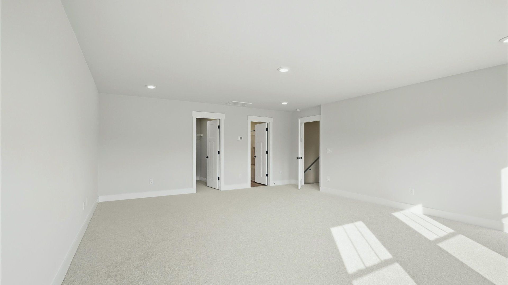 Inviting bedroom with tasteful finishes and large windows that create a fresh, open ambiance in Woodruff, SC