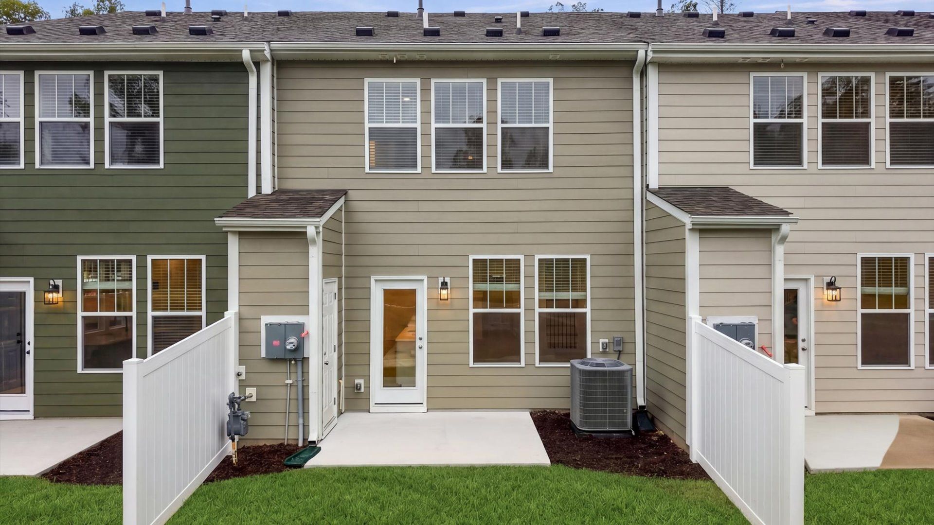 Eye-catching rear exterior with timeless color palette and superior architectural detail located at Brookland Place