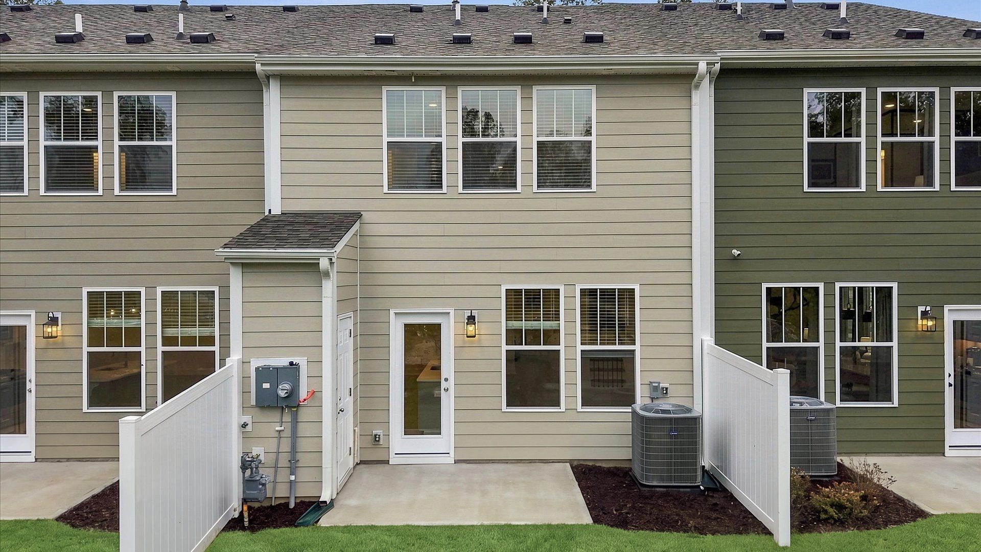 Elegant rear exterior with a private backyard—perfect for relaxing or entertaining outdoors at Brookland Place