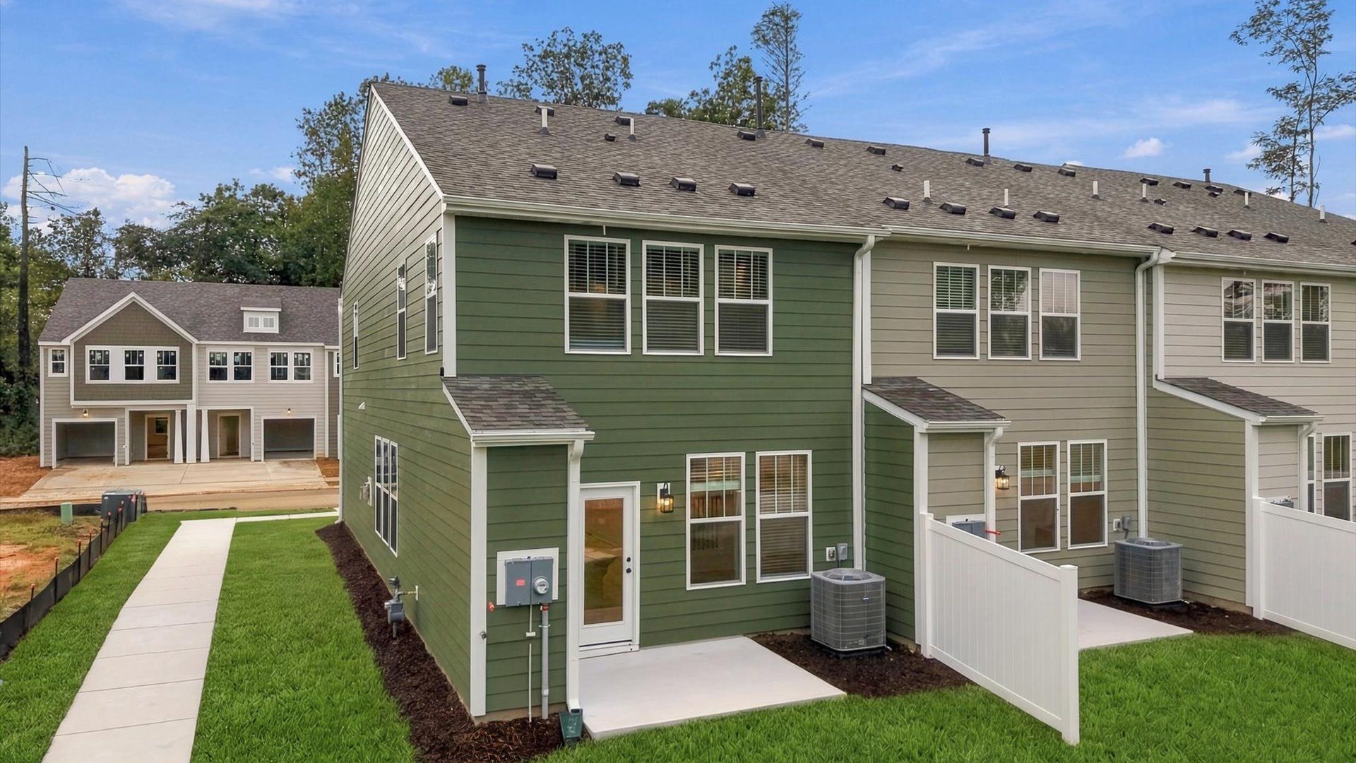 Vibrant rear exterior in a thoughtfully planned community near city conveniences at Brookland Place