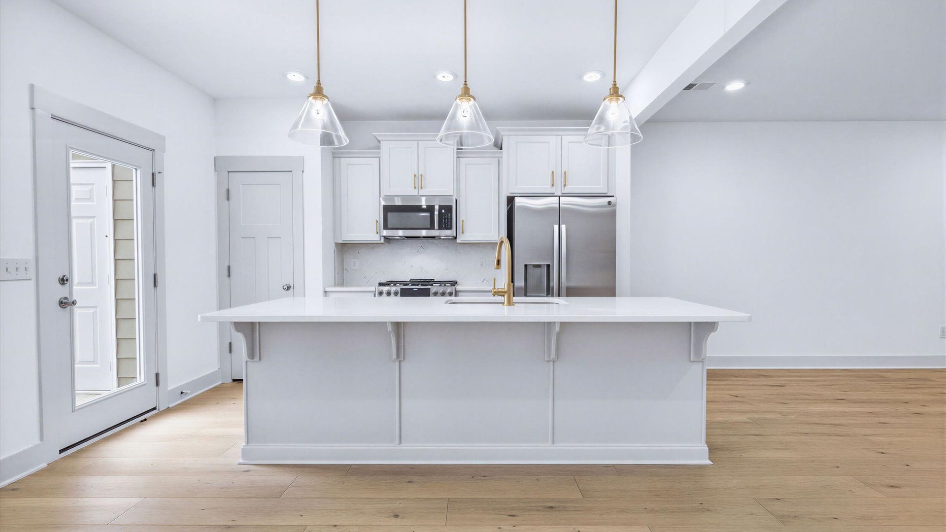 Notable kitchen space with elegant pendant lighting and a large island perfect for entertaining in Hendersonville, NC