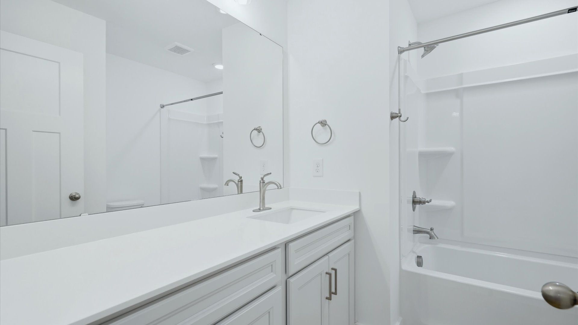Vibrant and welcoming bathroom with elegant countertop space and polished details at the Brookland Place community